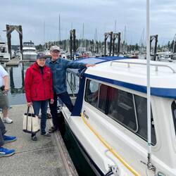 One of the USCG Auxiliary members doing our safety inspections, with Brock from Songbird