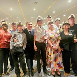 The captain (the only one without a captain's hat) with the captains crew.