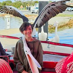 Thomas with Perch the pelican. Cpt Jack rescued Perch as a youngster.