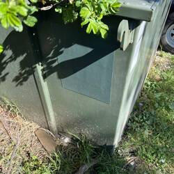 Clever Geocache. A magnetic sheet with a page protector holding the log sheet behind it.