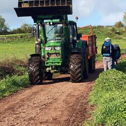 Stepping aside for the farm machinery, we like to watch the machines do their work