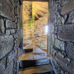 Interior stone spiral staircase.