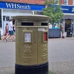 A golden post box painted to celebrate local rower Anna Watkins winning gold at the 2012 Olympics