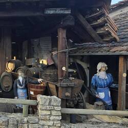 Some of the village grape presses on display with scary looking manikins