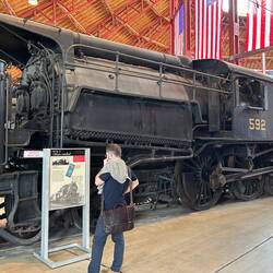 Large boiler on this Camelback locomotive required two butterfly firedoors at fireman's position