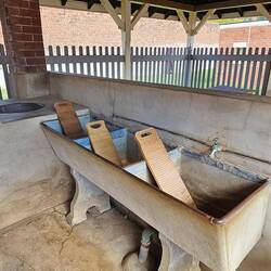 Inside the exercise yard. Clearly the females did the laundry. Note the "copper" and washboards.