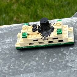 Cute geocache container. The smoke stack is actually a tiny pill bottle with the log.