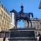 The Duke of Wellington statue with traffic cones on his head.
