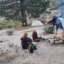 Campsite for the night with another campfire.