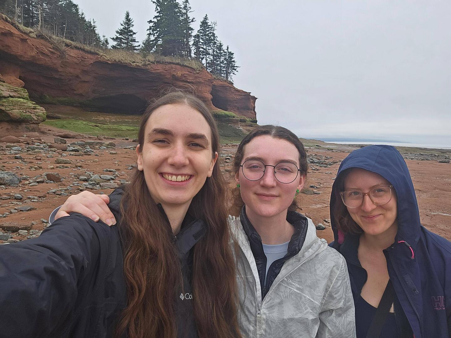 A selfie with the large rock formation at low tide