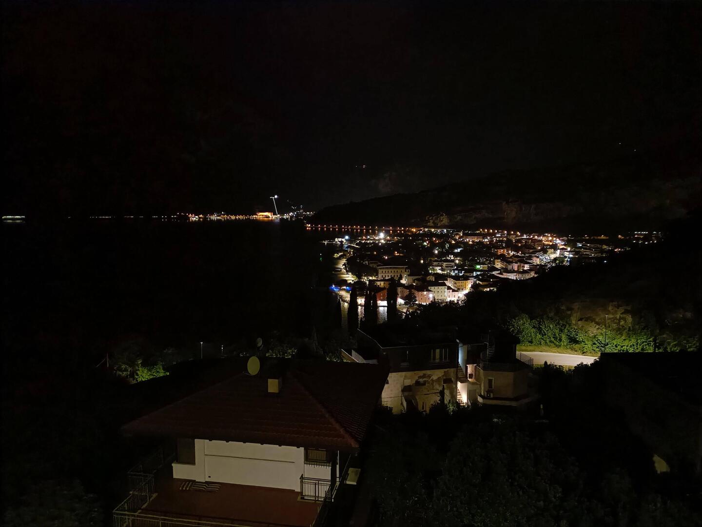 Night-time view of Torbole and Lake Garda