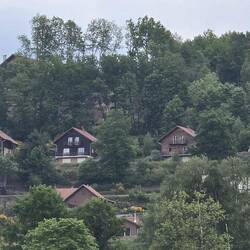 Swiss style chalet in hills over the village