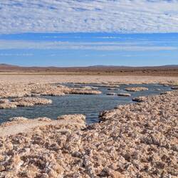 Weird lake in the desert amid salt formations