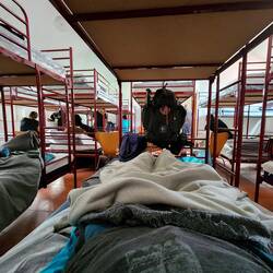 Tight squeeze tonight, 28 to a room. All full. Some mattresses on the floor downstairs. $8. Beds!😁