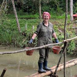 Carrying buckets of cement across the bamboo bridge, don't spill !!