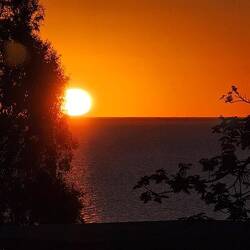 The sun appears to touch down on Lake Menindee