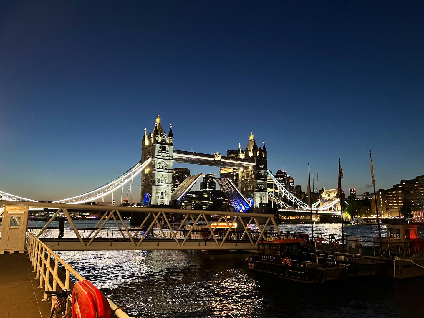 Tower Bridge crossing the Thames River in London at dusk