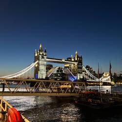 Tower Bridge crossing the Thames River in London at dusk