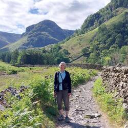 En route; Eagle Crag behind Helen