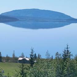 A reflection in the ocean so calm.