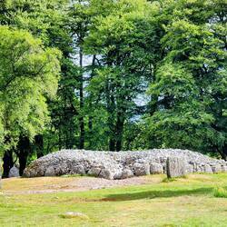 The cairn and standing stones circling the mound