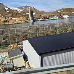 Fish drying racks. Dried cod is their primary industry. Dried fish will keep for 10 years.