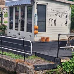 Banksy style art on this canalside garden shed