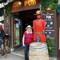 Beth posing outside the Canadian Pub with a Mountie