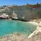 Towering sandstone cliffs surround this cove