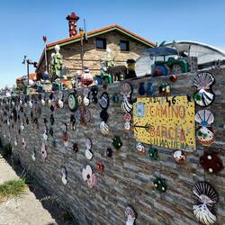 On the top of the hill is this junk sculpture creation of a home.✨️