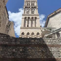 Roman wall with cathedral bell tower