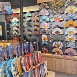 Fans are popular and used by men and woman in the heat