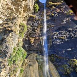 Hovering in heli in front of waterfall