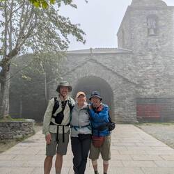 O'Cebreiro with BMCS Pilgrims in front of the amazing church. Fog and all