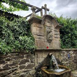 Fountains on the side street with a place to sit.