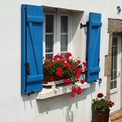 Country town house window near Hotel de la Plage