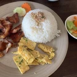 One of a typical Cambodian breakfast dishes, grilled pork rice.