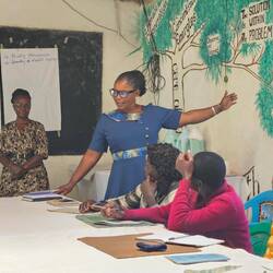 Lillian providing information to the leaders