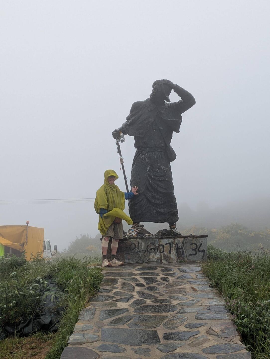 This large statue is about to lose his hat and my Poncho wants to fly away