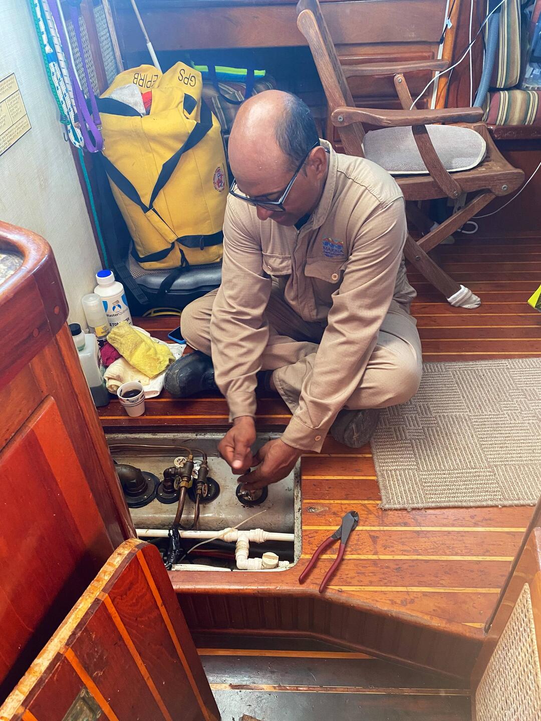 Humberto checks the fuel tanks for turbidity and determines only the port tank needs cleaning.