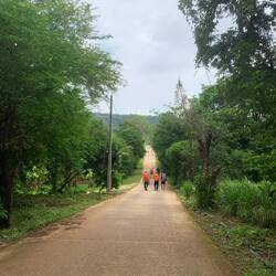 Walking out of the village toward the foot of the mountain where the National Park is.