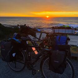 Sun rising over Maybe Thom and Sexy Pete.