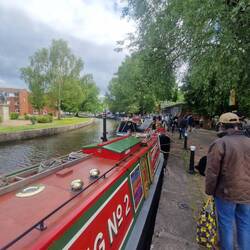 A collection of traditional and working boats lined the towpath