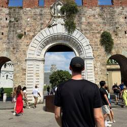 Heading into Pisa- see the tower through the arch?