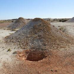Prospecting hole - testing to see if there is any opals down there