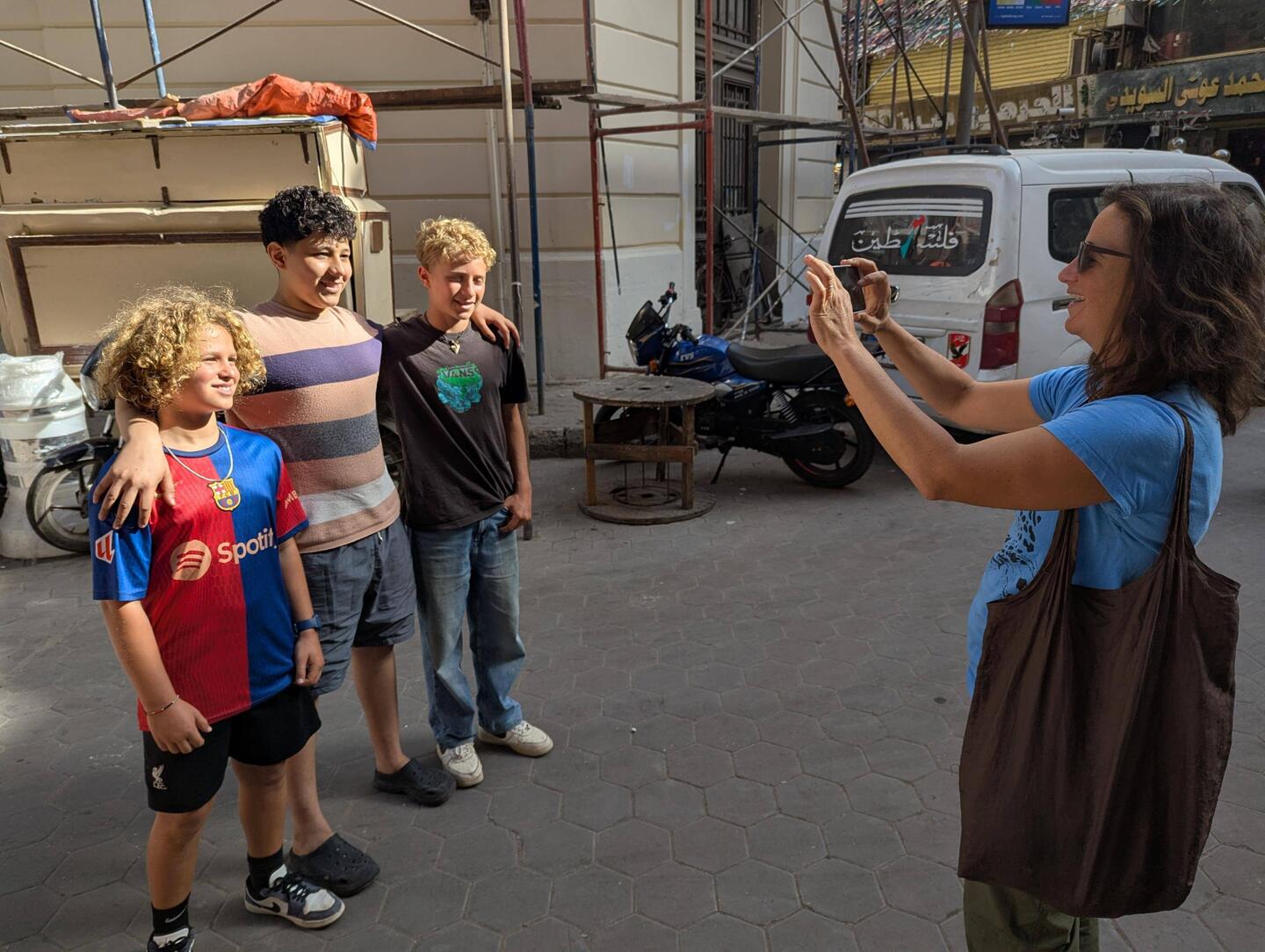 Random kid asking to take a photo with us (on his own phone)