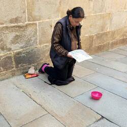 She kneels all day for euros.