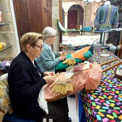 I saw women making lace in a yarn shop.