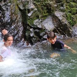 Boys in the waterfall.
