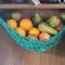Making use of vertical space with a macrame fruit hammock